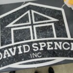 A black and white logo for David Spencer Inc.