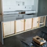 Wooden frame structure in a modern kitchen setting.