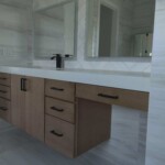 Modern bathroom vanity with wood cabinets and large mirror.
